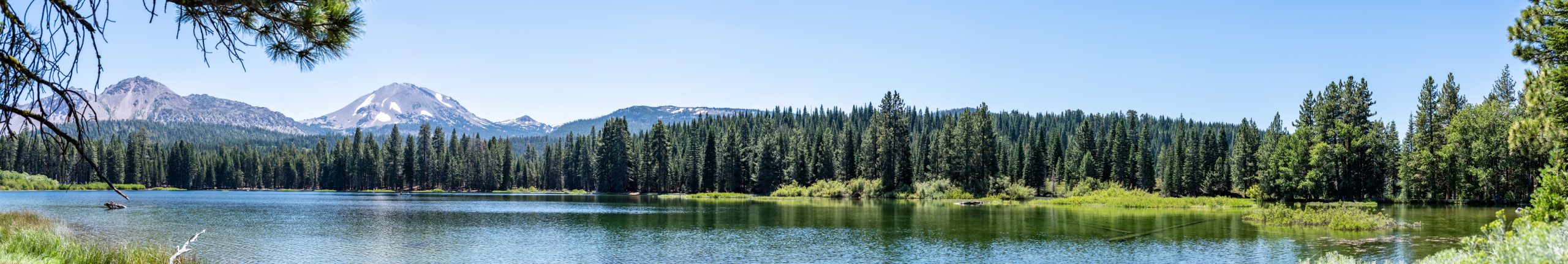 Panoramic view across Manzanita Lake in Lassen Volcanic National Park, California . High quality photo